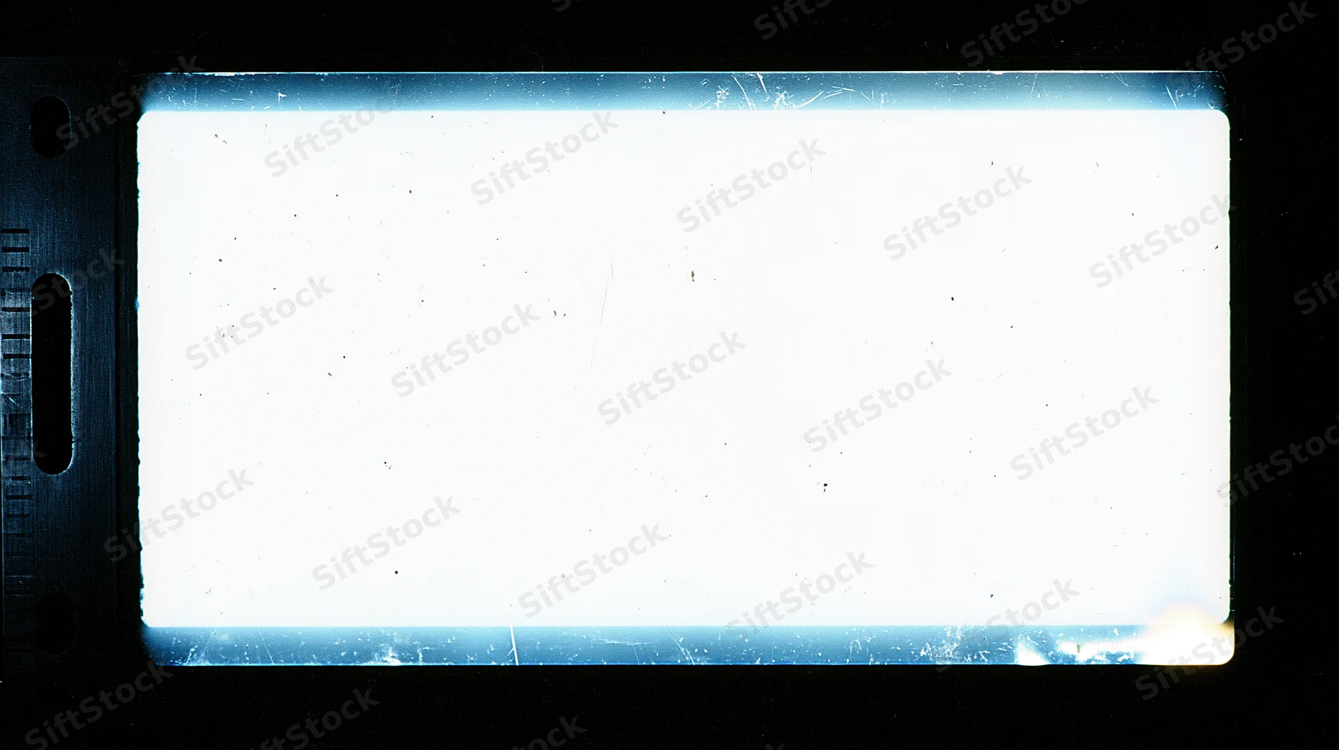 Overexposed blank 16mm film frame with sprocket holes on black background