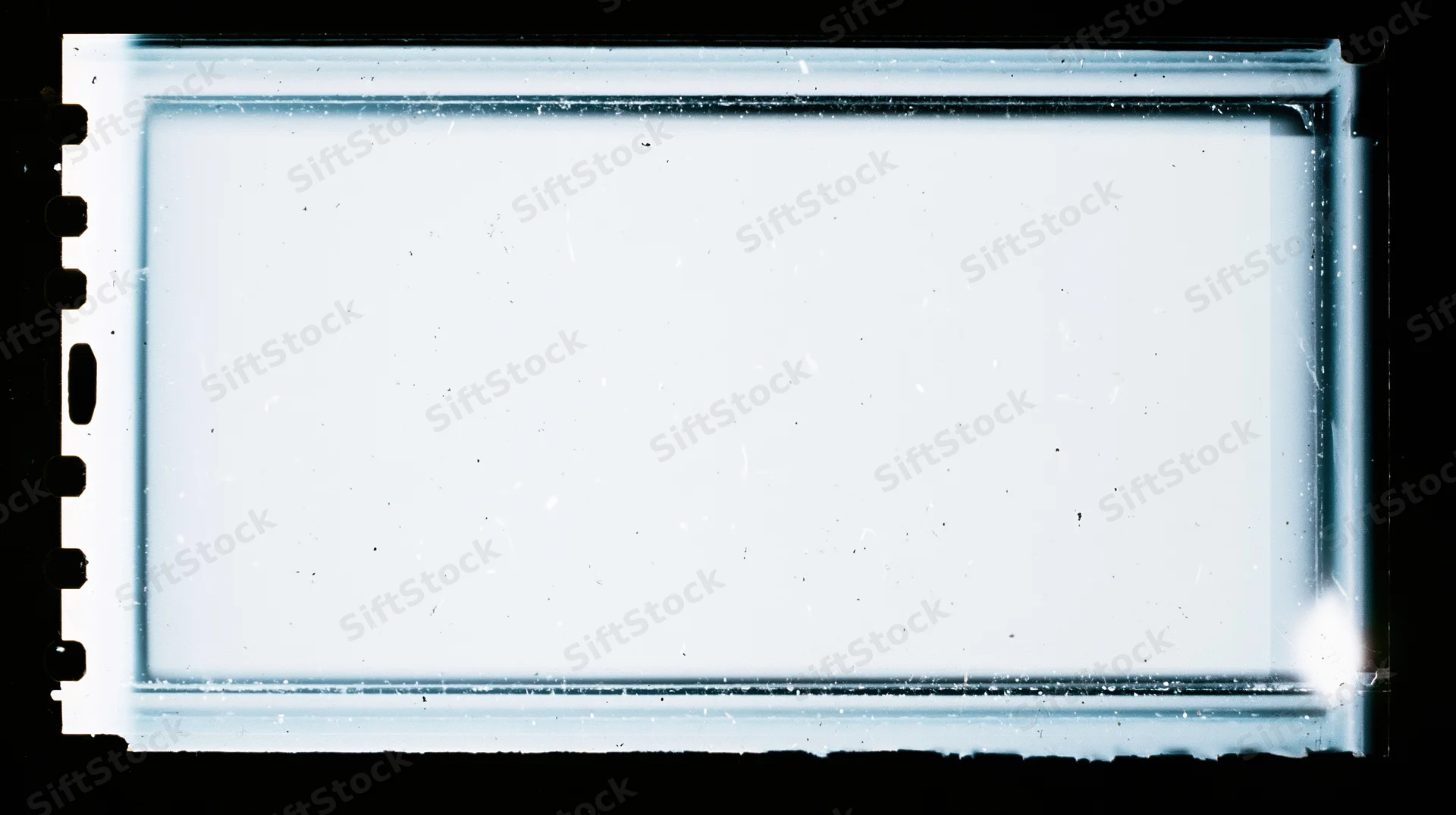 Blank overexposed 16mm film frame with sprocket holes on black background