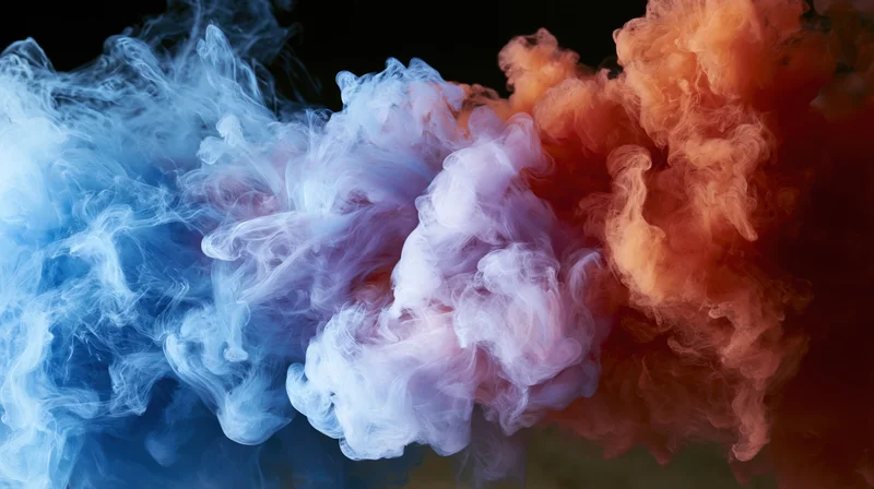 Blue and red ink clouds colliding and dispersing in water against a dark background