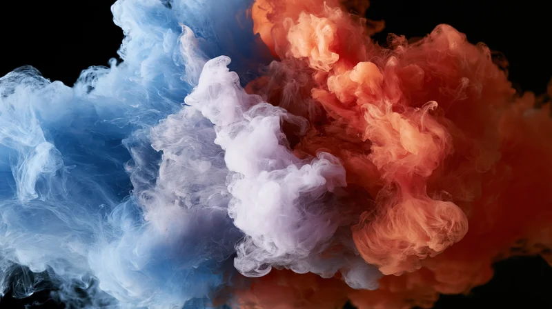 Blue and red ink clouds colliding and dispersing in water against black background