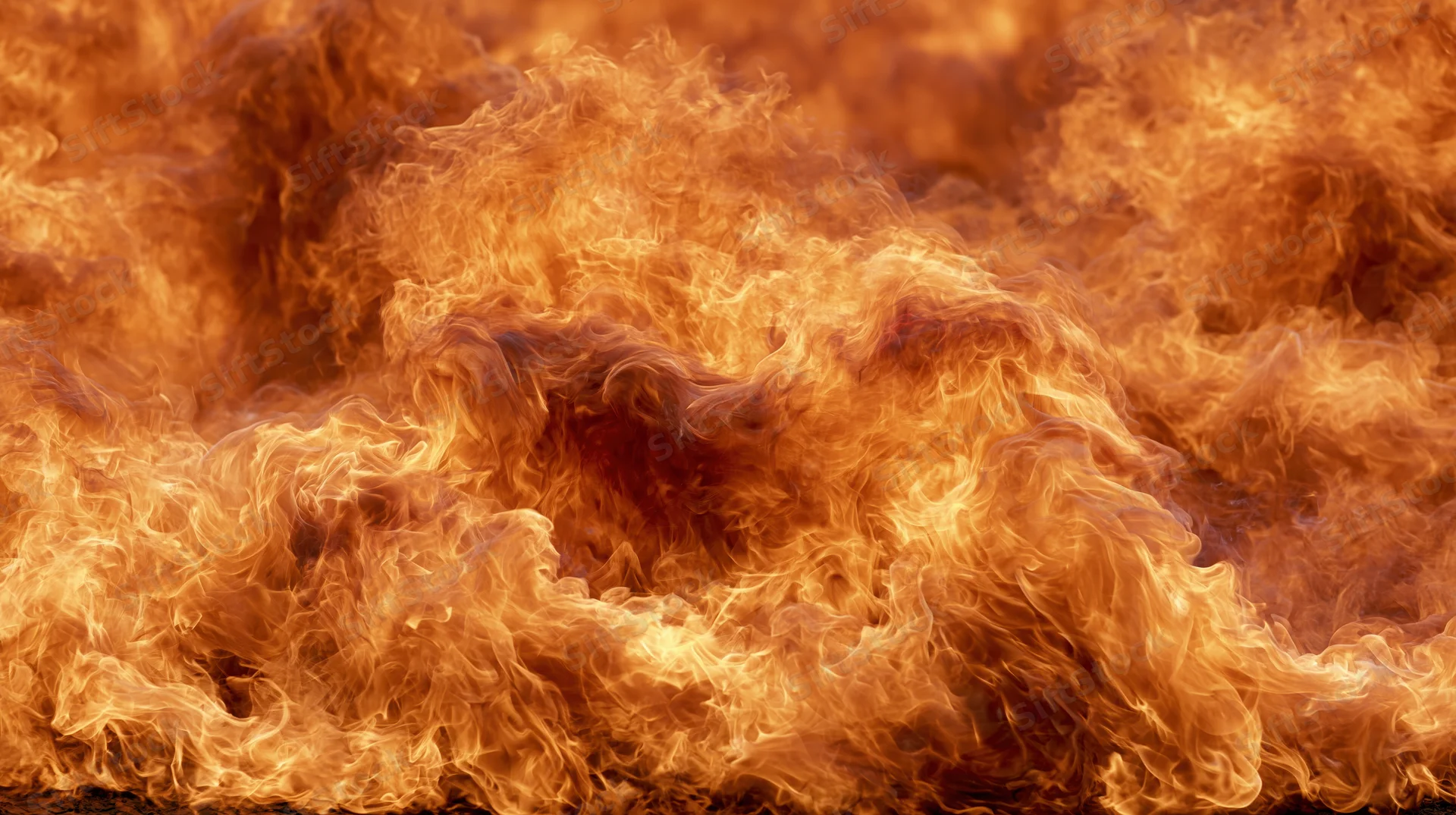 Close-up of intense flames burning across the frame