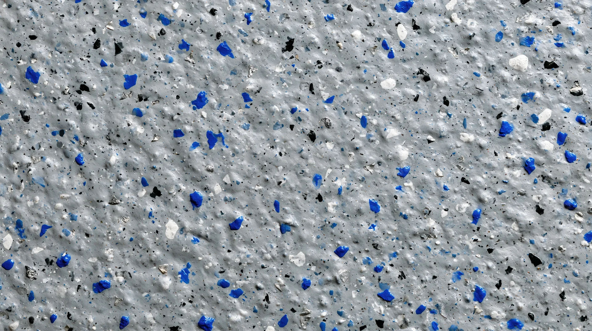 Close-up of grey epoxy floor with blue and white speckles
