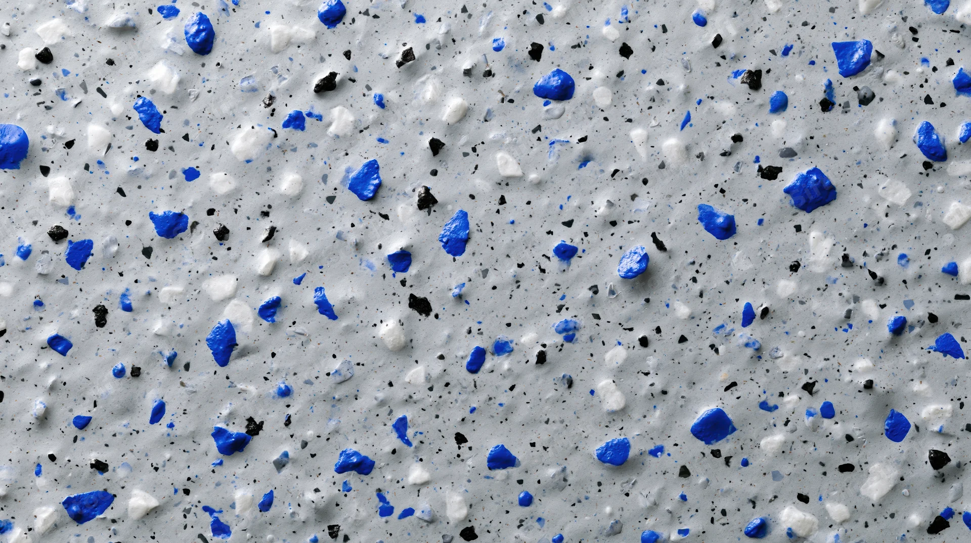 Close-up of grey epoxy floor with blue white and black speckles