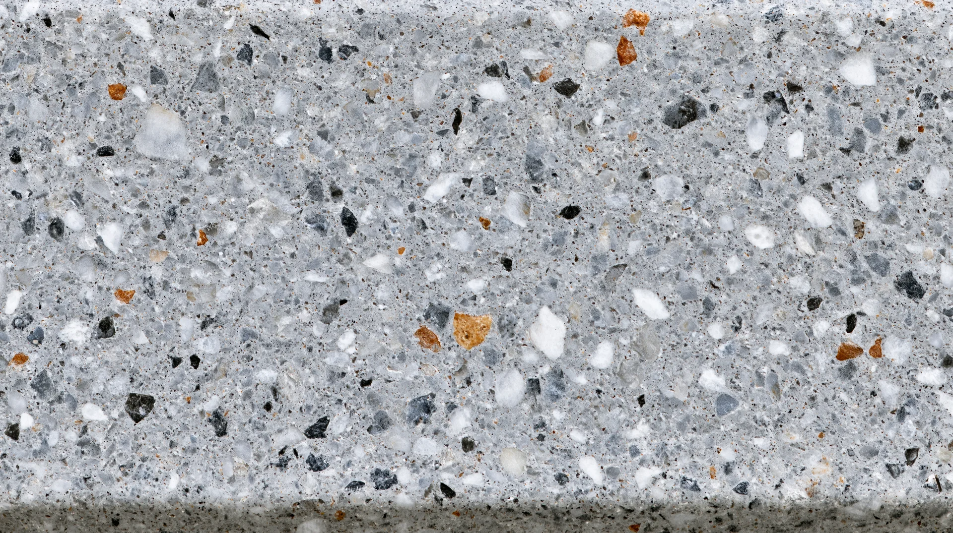 Close-up of polished terrazzo floor surface with embedded stone aggregate