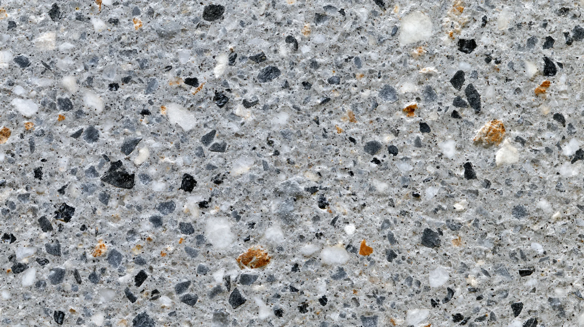 Close-up of polished terrazzo floor surface with gray and black aggregate speckles
