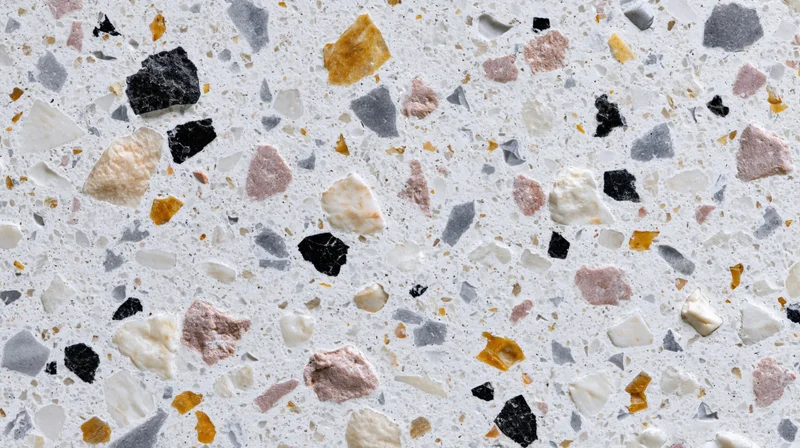 Close-up of terrazzo floor surface with embedded stone fragments in white and multicolored tones