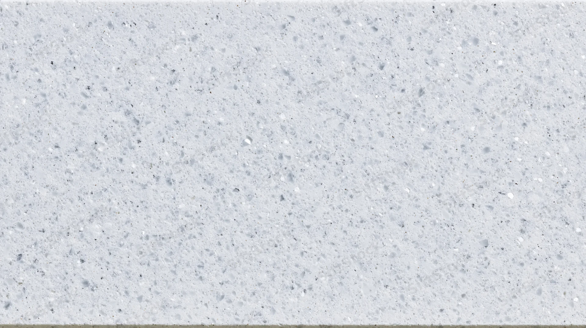 Close-up of a white speckled terrazzo or quartz composite countertop surface