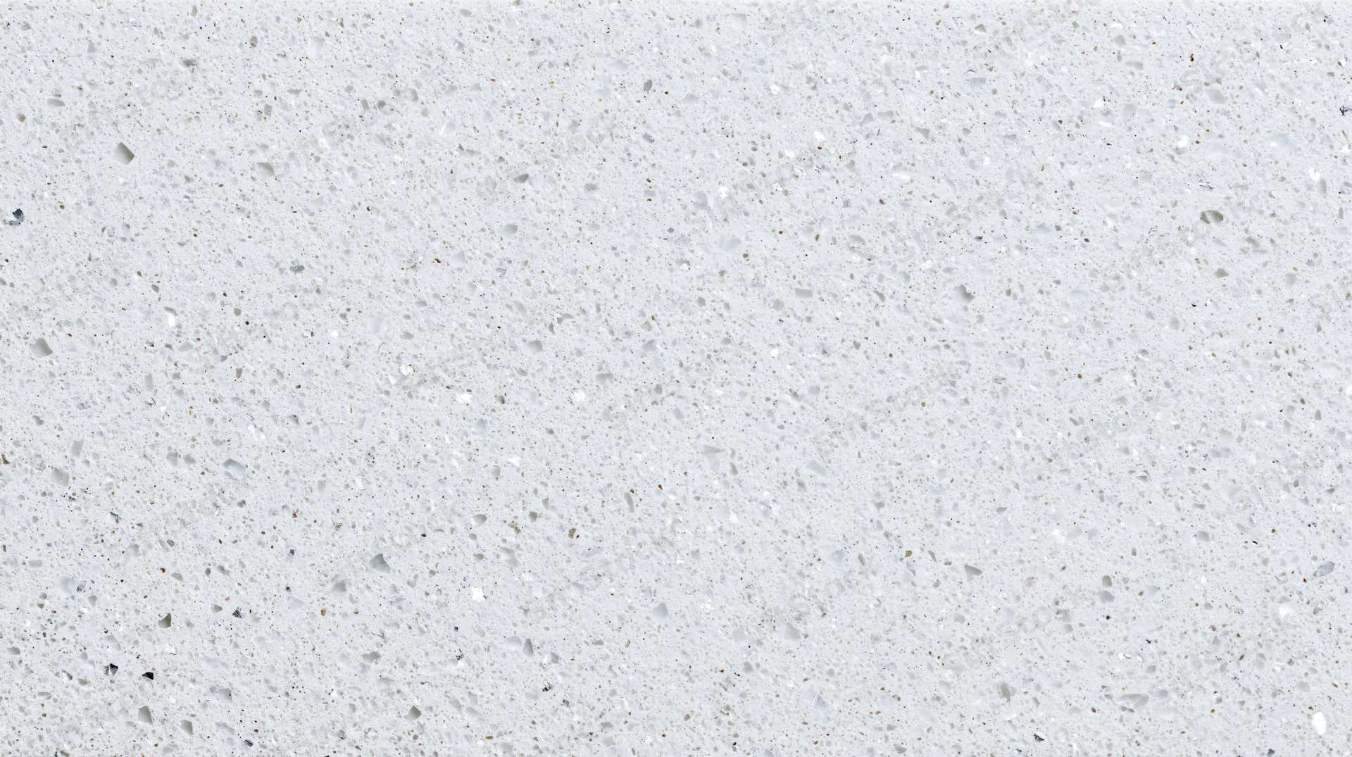 Close-up of white terrazzo or quartz composite surface with speckled texture