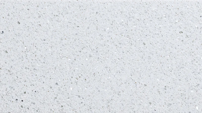 Close-up of white terrazzo or quartz composite surface with speckled texture