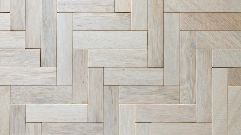 Close-up of light bleached oak herringbone parquet flooring pattern