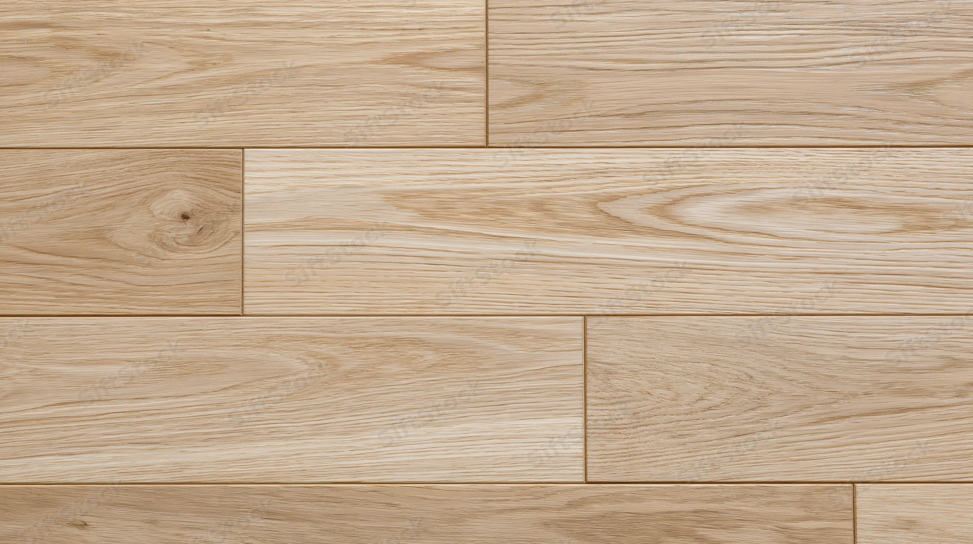 Close-up of light oak hardwood flooring planks arranged in a staggered pattern