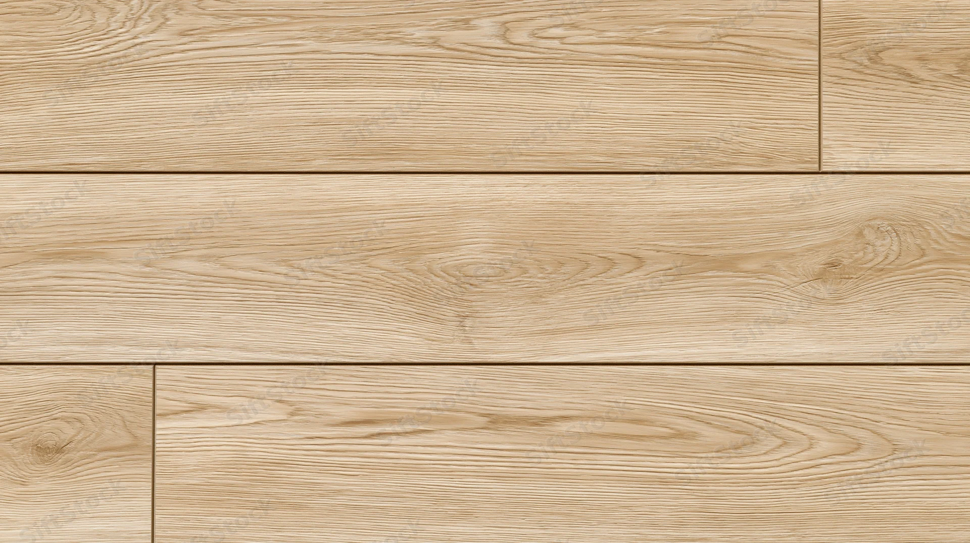 Close-up of light oak laminate flooring planks laid in a staggered pattern