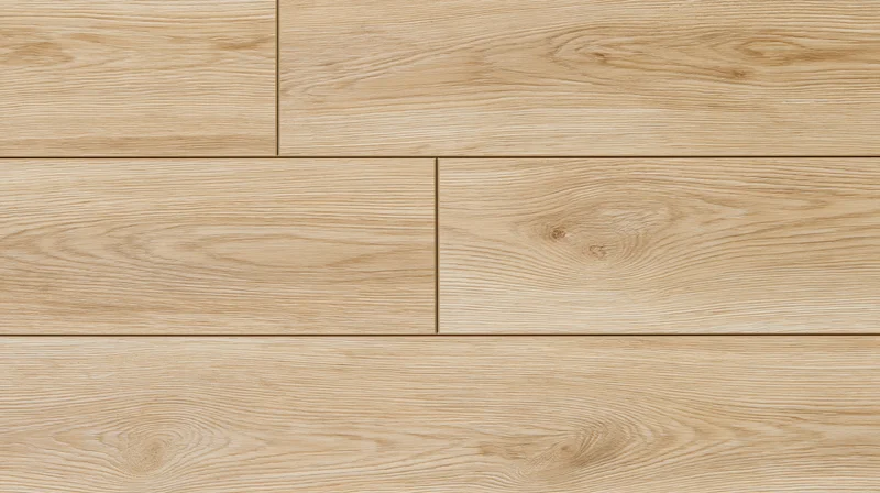 Close-up of light oak laminate flooring planks arranged in a staggered pattern