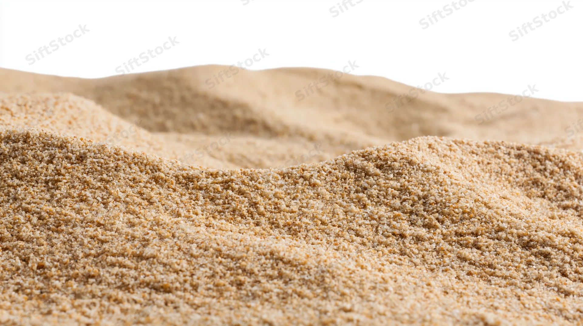 Close-up of dry beach sand texture filling the frame with soft undulations and fine granules