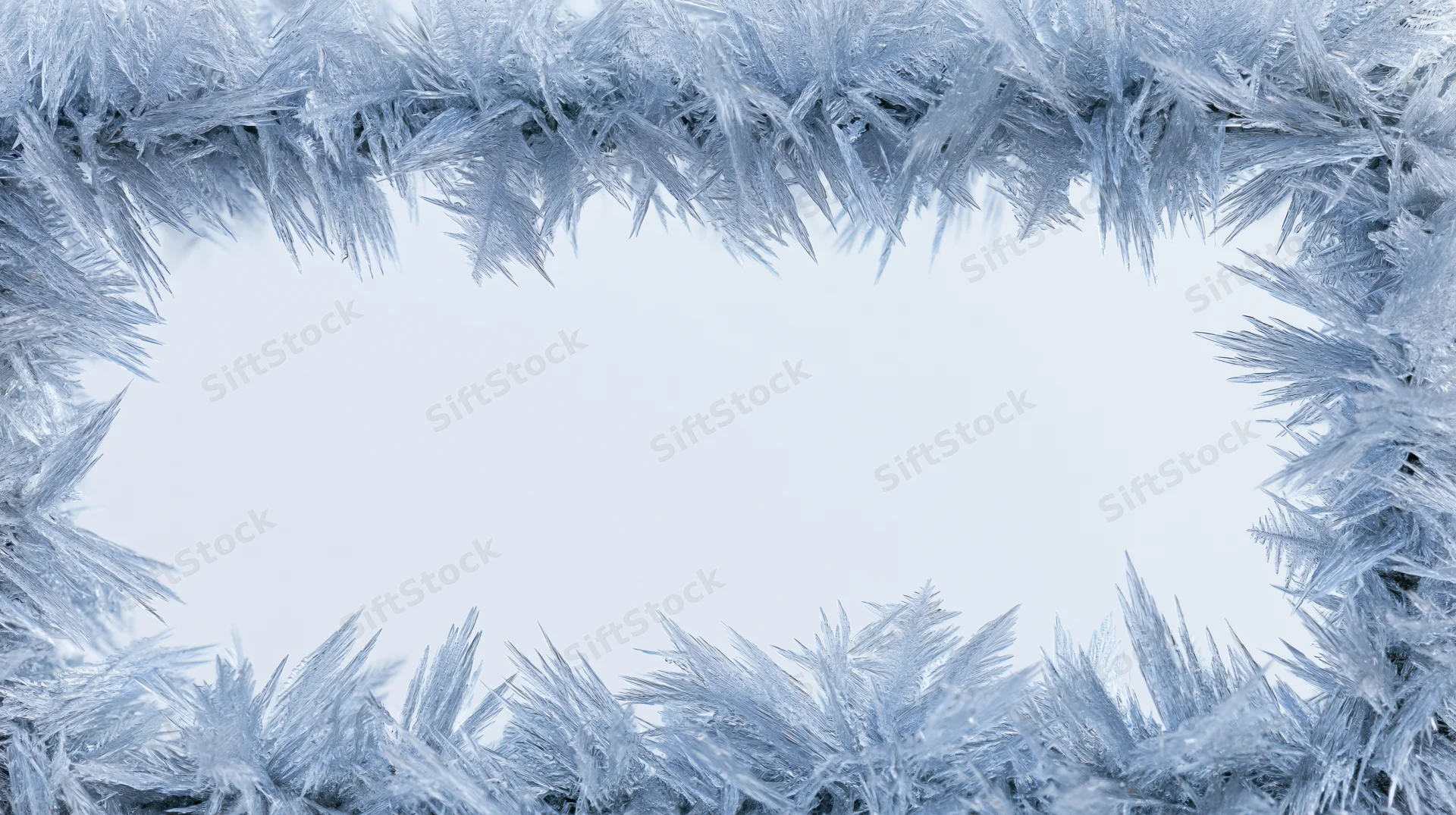 Frost crystals forming a frame around a blank white center