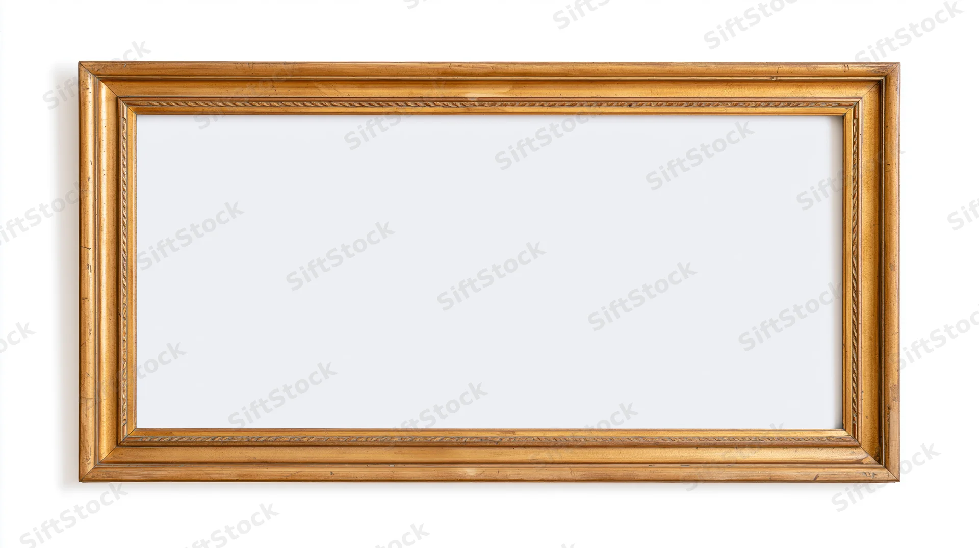 Empty antique gold picture frame with ornate narrow molding on white background