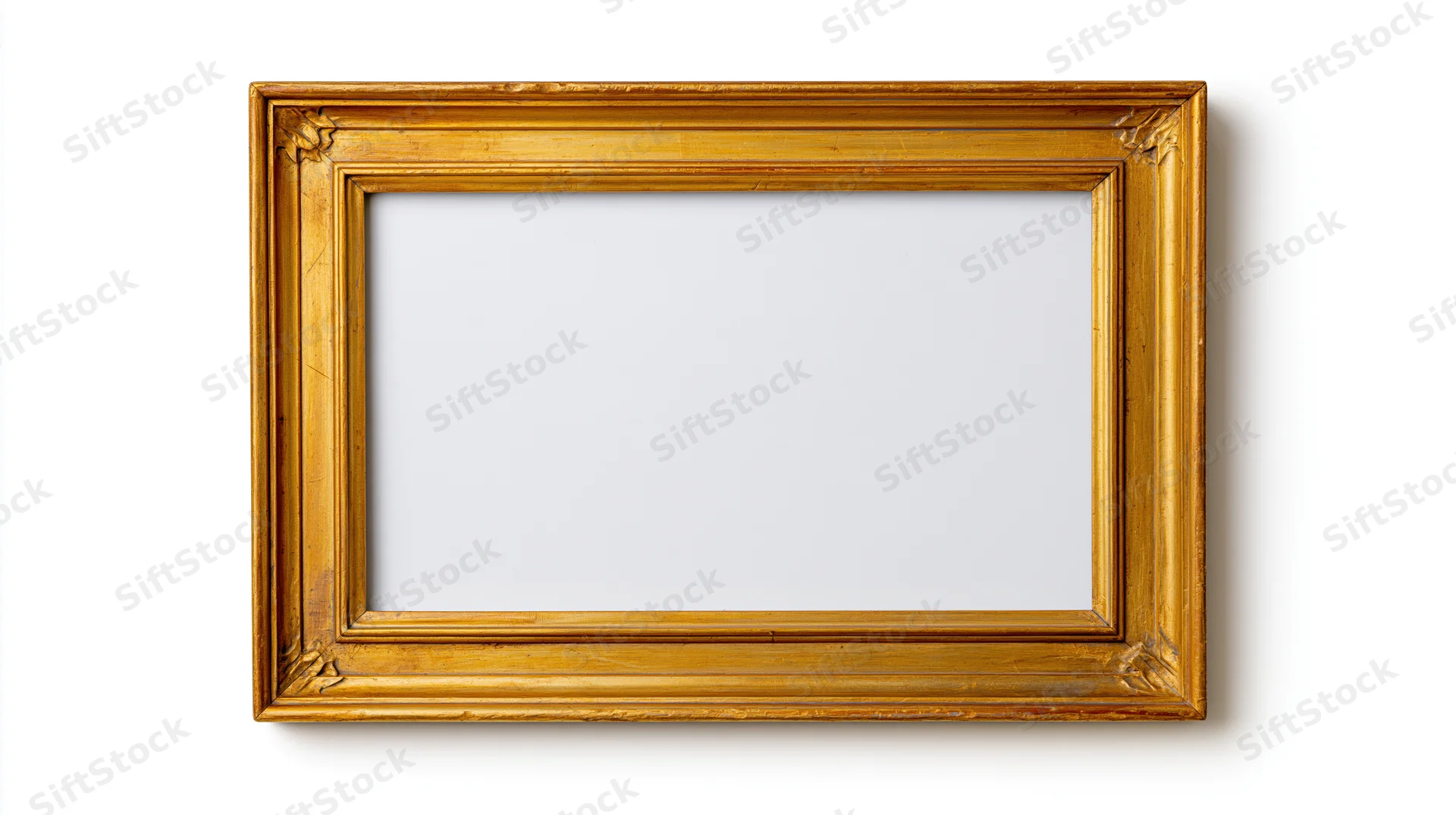 Empty antique gold ornate picture frame on white background