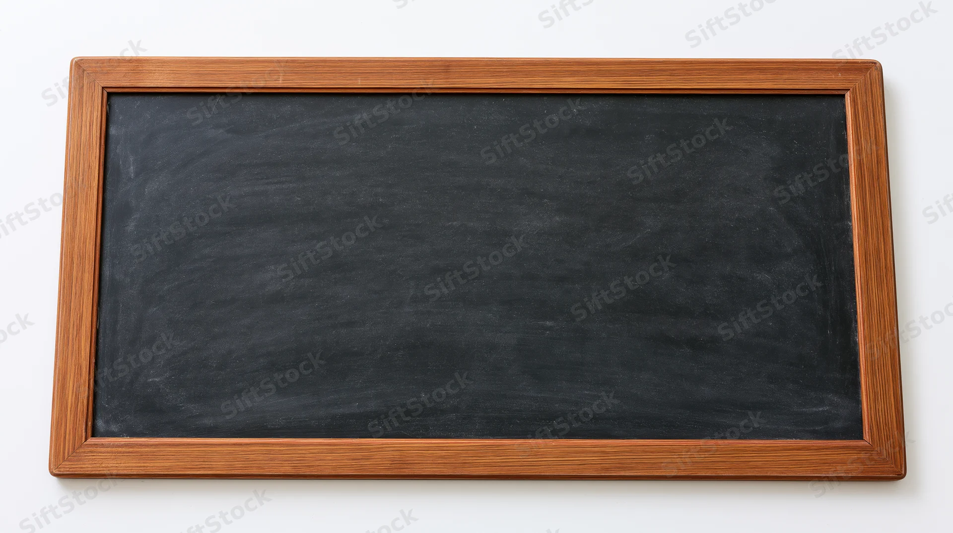 Empty blackboard with faint chalk smudges and eraser marks in wooden frame against white background