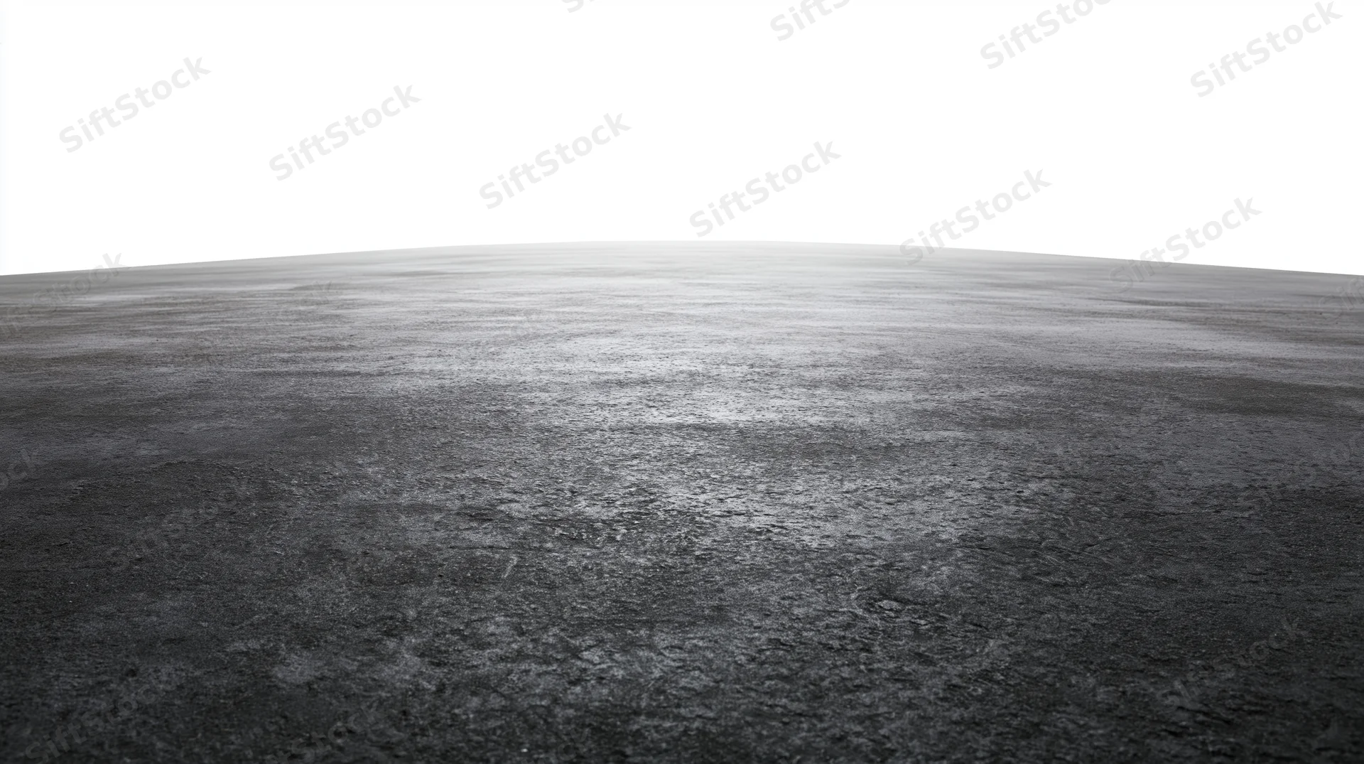 Dark concrete floor surface extending to a white background
