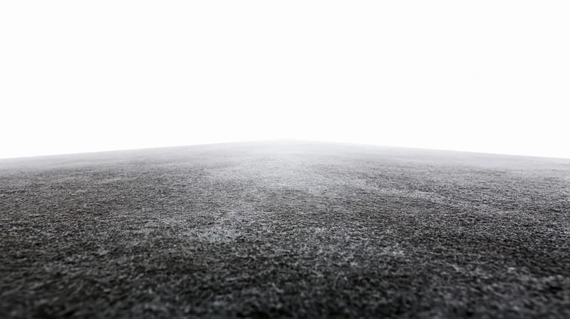 Dark concrete floor surface extending to white background
