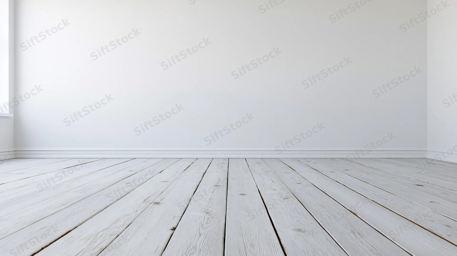 Empty room with whitewashed wooden plank floor and white walls