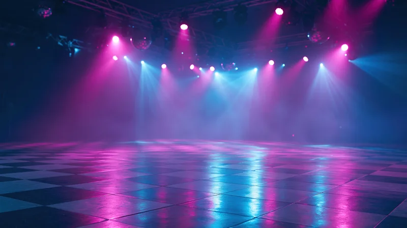 Empty nightclub dance floor with checkered tiles under colorful spotlights