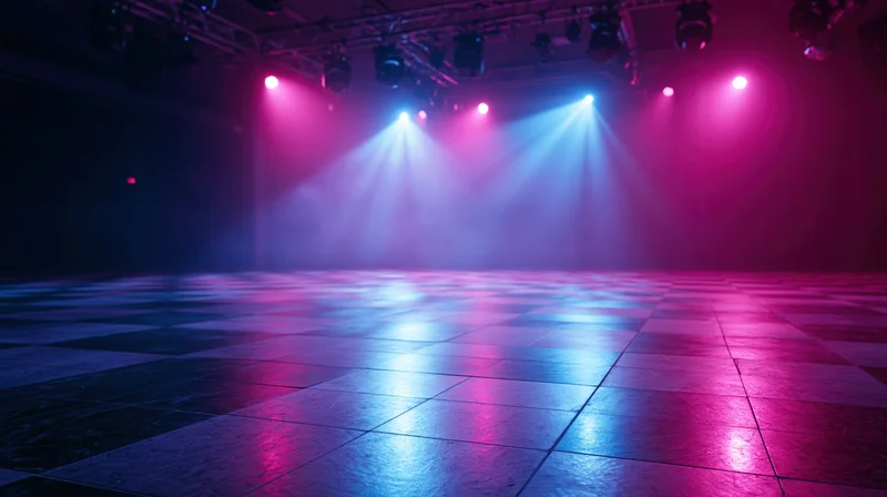 Empty nightclub dance floor with checkered tiles under colorful spotlights