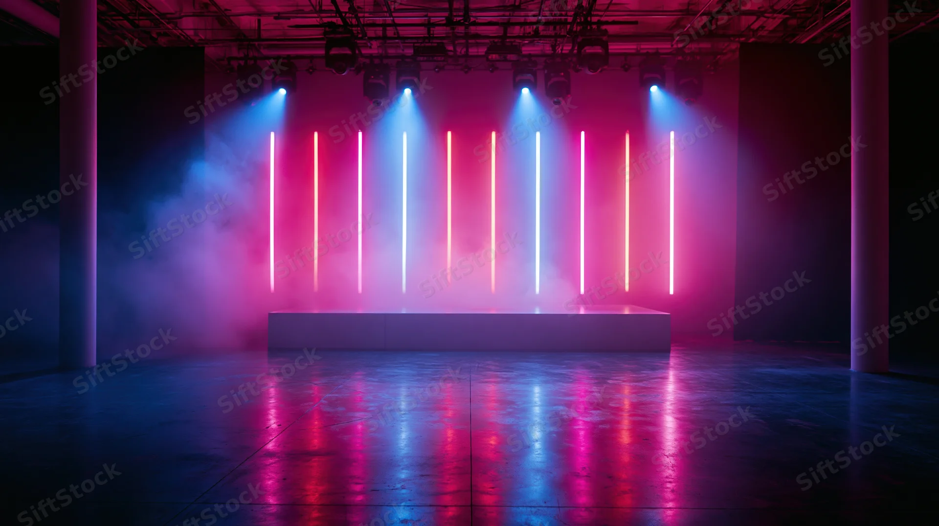 Empty concert venue stage with neon lights and smoke under spotlights