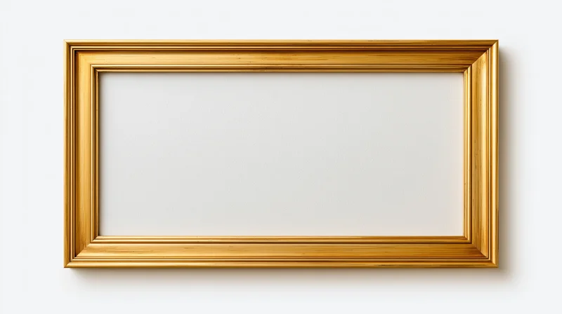 Empty gold picture frame with ornate molded edges hanging on a white wall