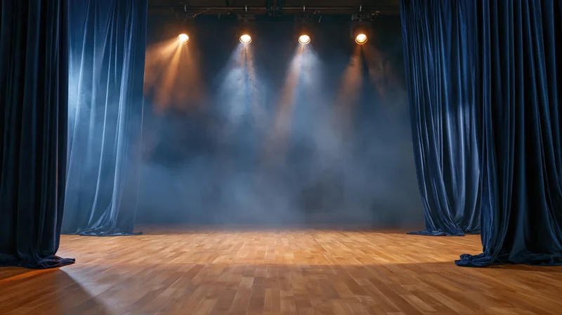 Empty theater stage with spotlights and smoke between blue curtains
