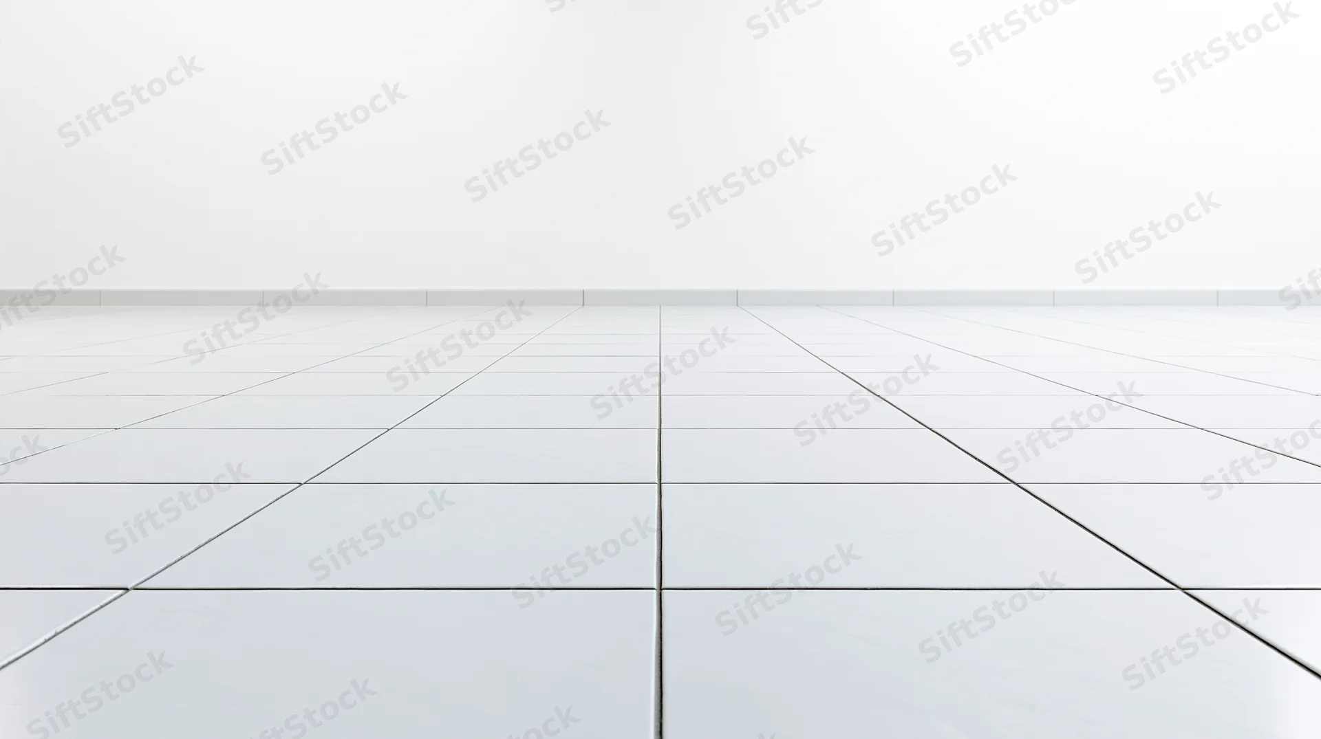 White ceramic tile floor receding into a plain white interior space