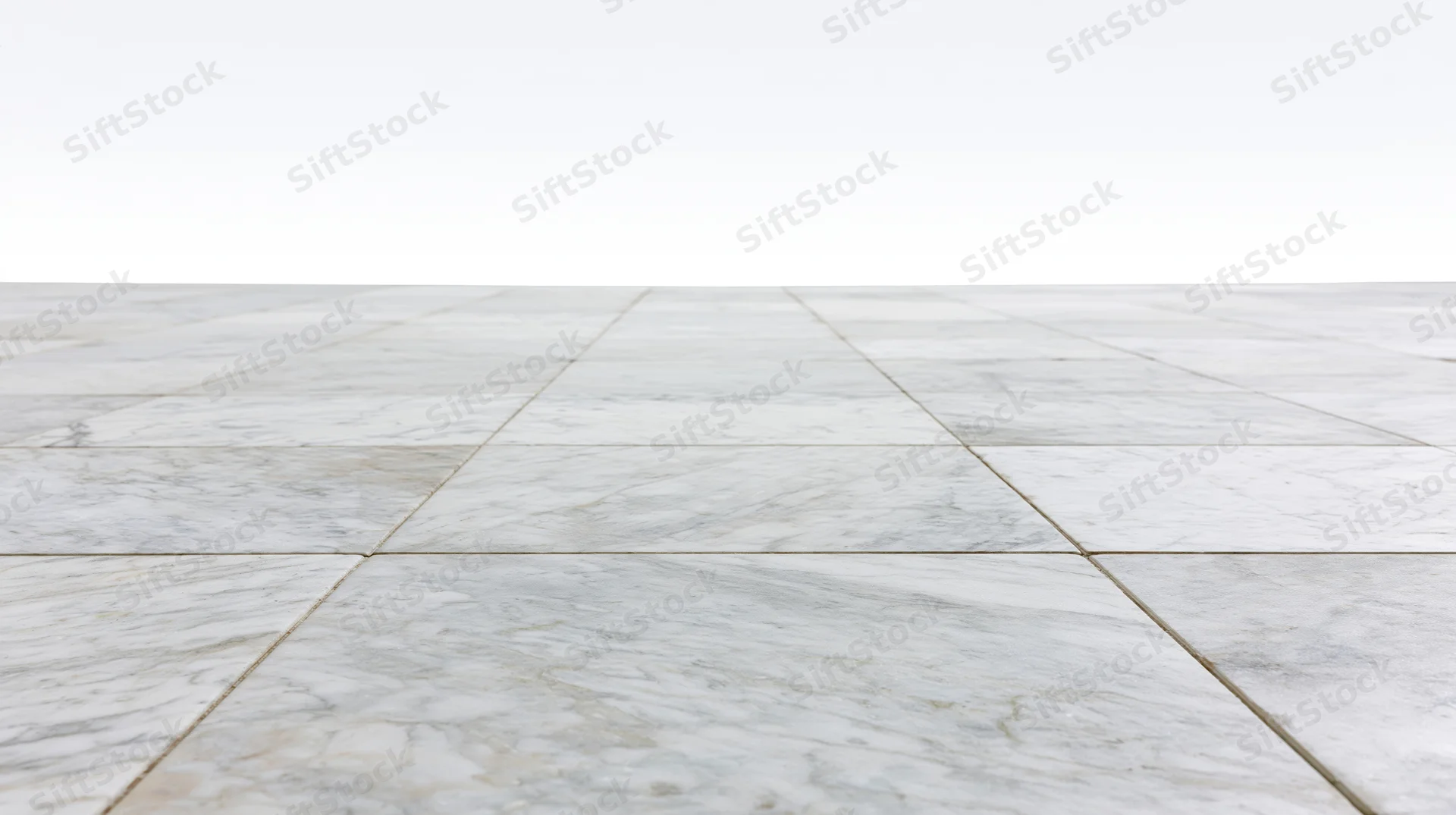 White marble tile floor extending into perspective with grout lines and copyspace above