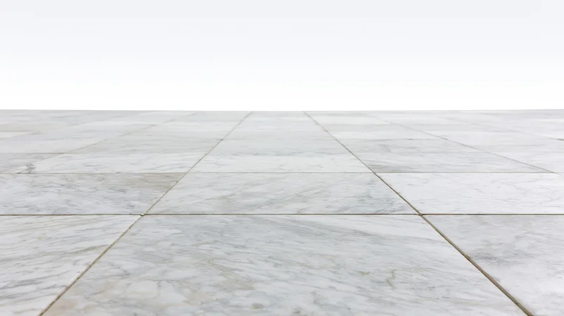 White marble tile floor extending into perspective with grout lines and copyspace above