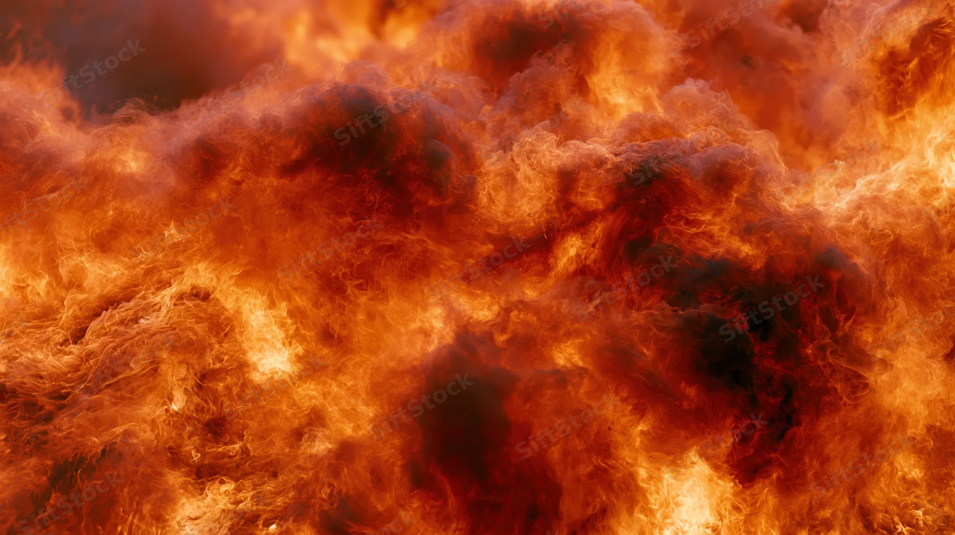 Intense flames billowing across the frame in a fiery blaze