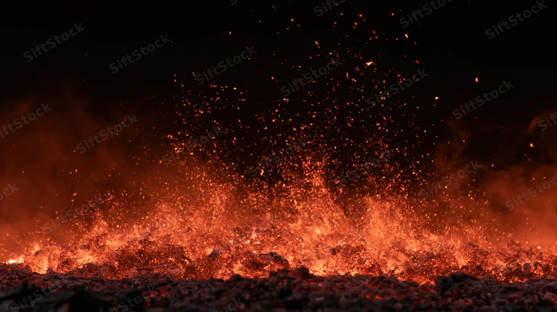 Glowing embers and sparks rising from molten lava at night
