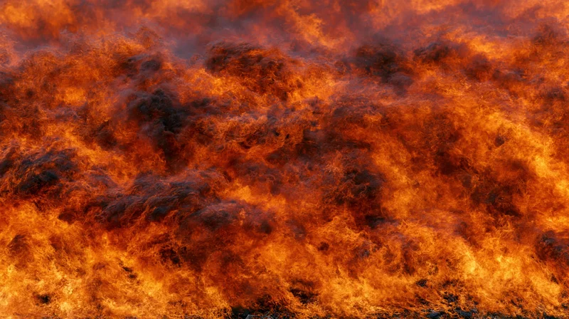 Massive wall of fire filling the frame in extreme close-up view