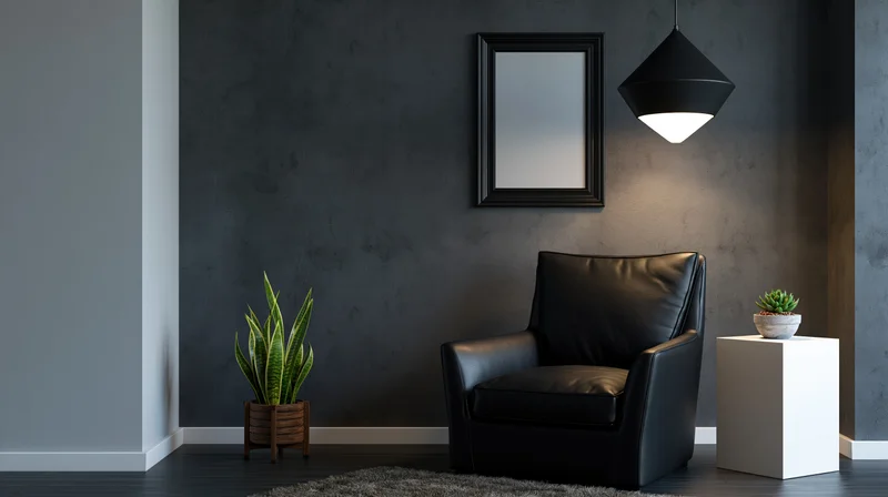 Black leather armchair in a minimalist corner with concrete wall, pendant light, and potted plants