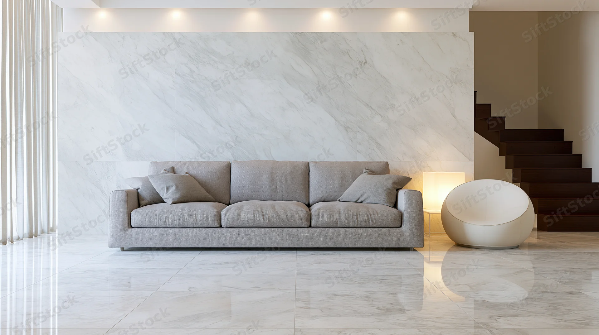 Minimalist luxury living room with grey sofa and marble walls and floor