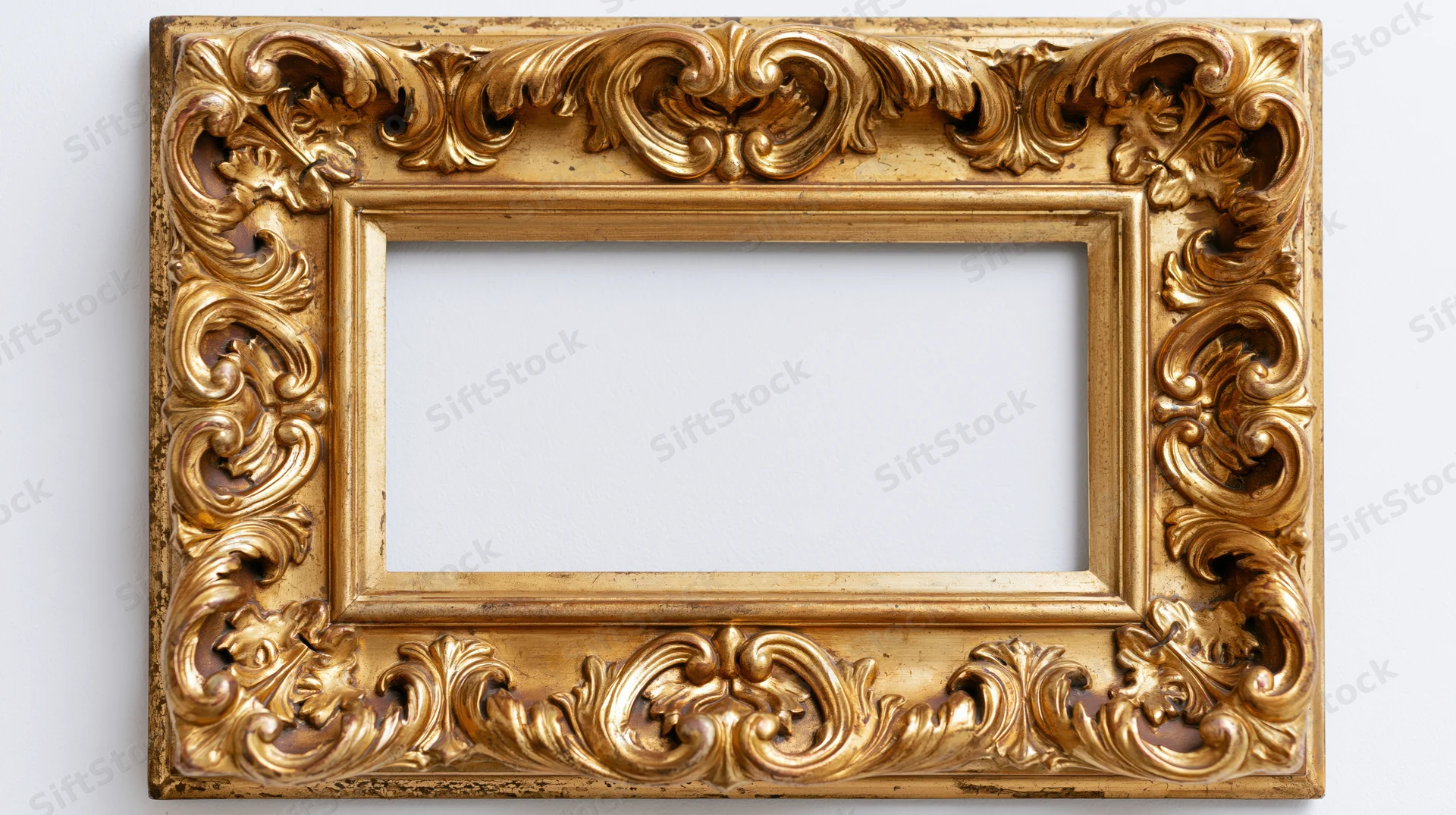 Ornate gilded baroque frame with carved floral details on white background