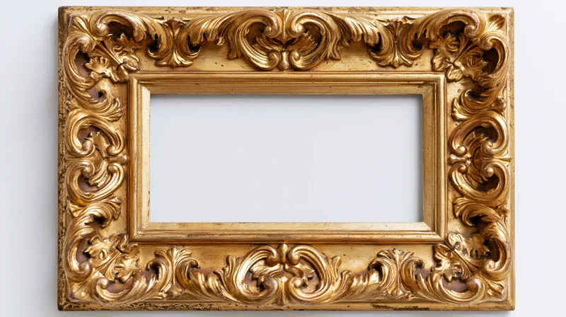 Ornate gilded baroque frame with carved floral details on white background