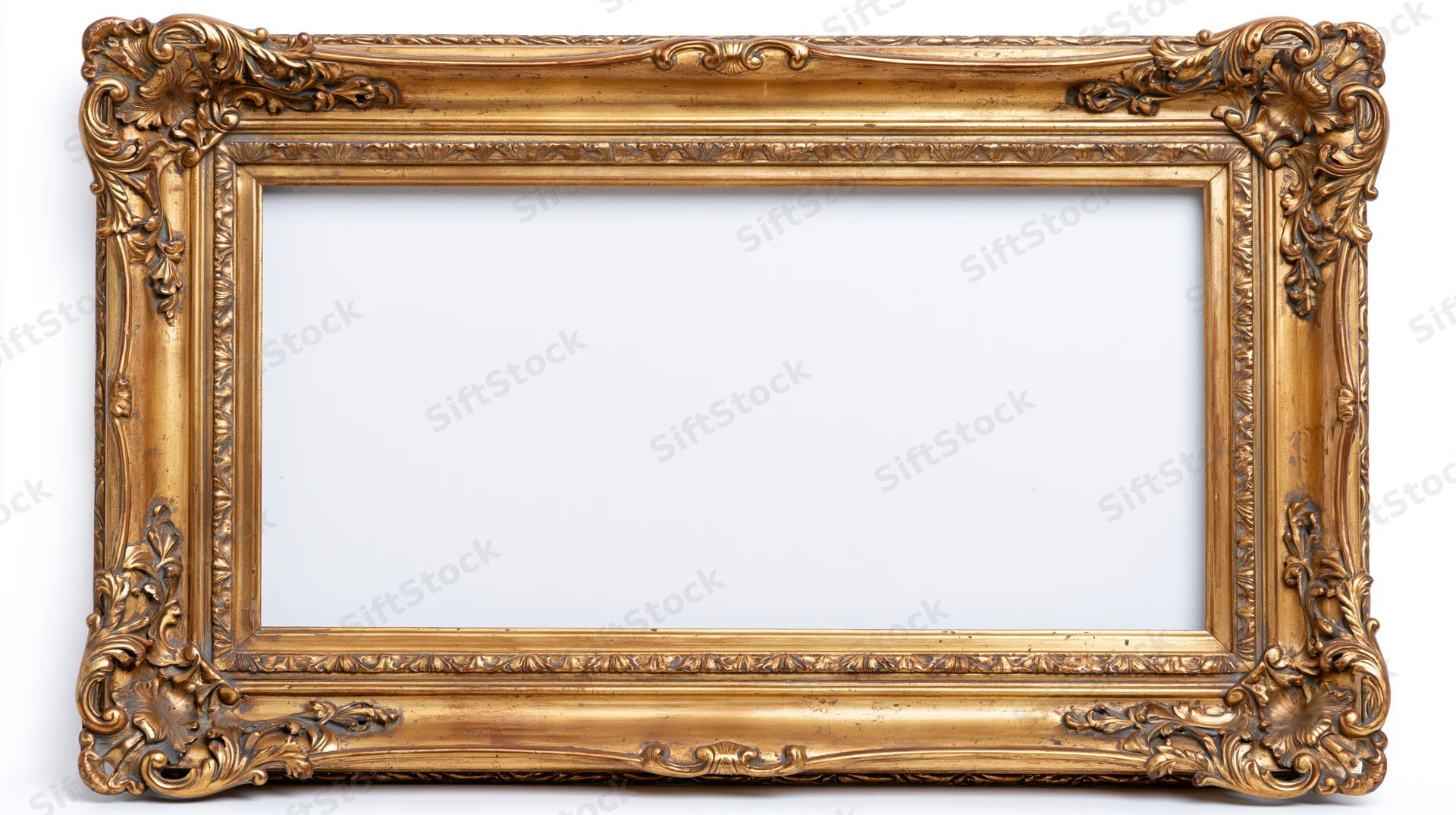 Ornate antique gold picture frame with baroque carved floral details on white background