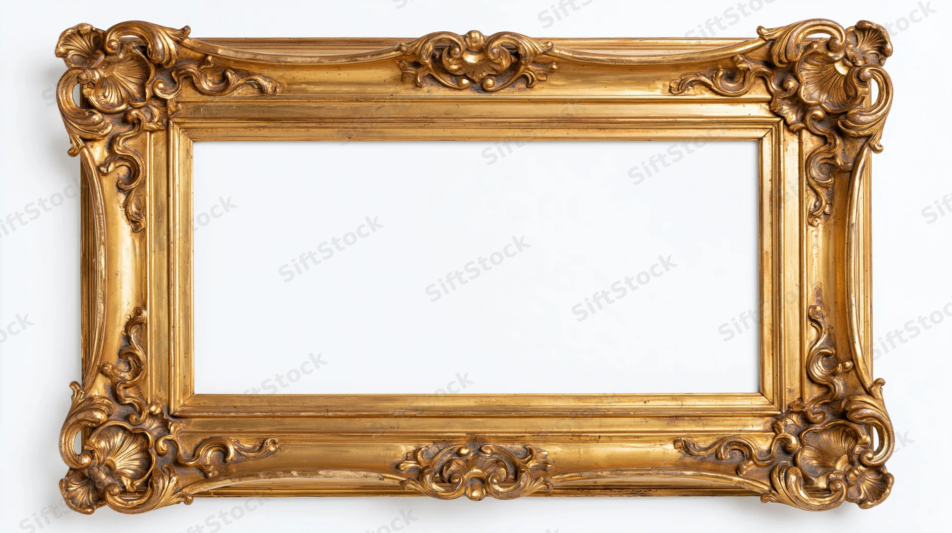Ornate antique gold picture frame with baroque carved floral details isolated on white background