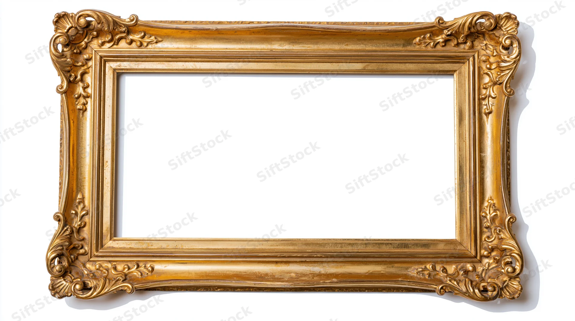 Ornate gold picture frame with baroque scrollwork isolated on white background