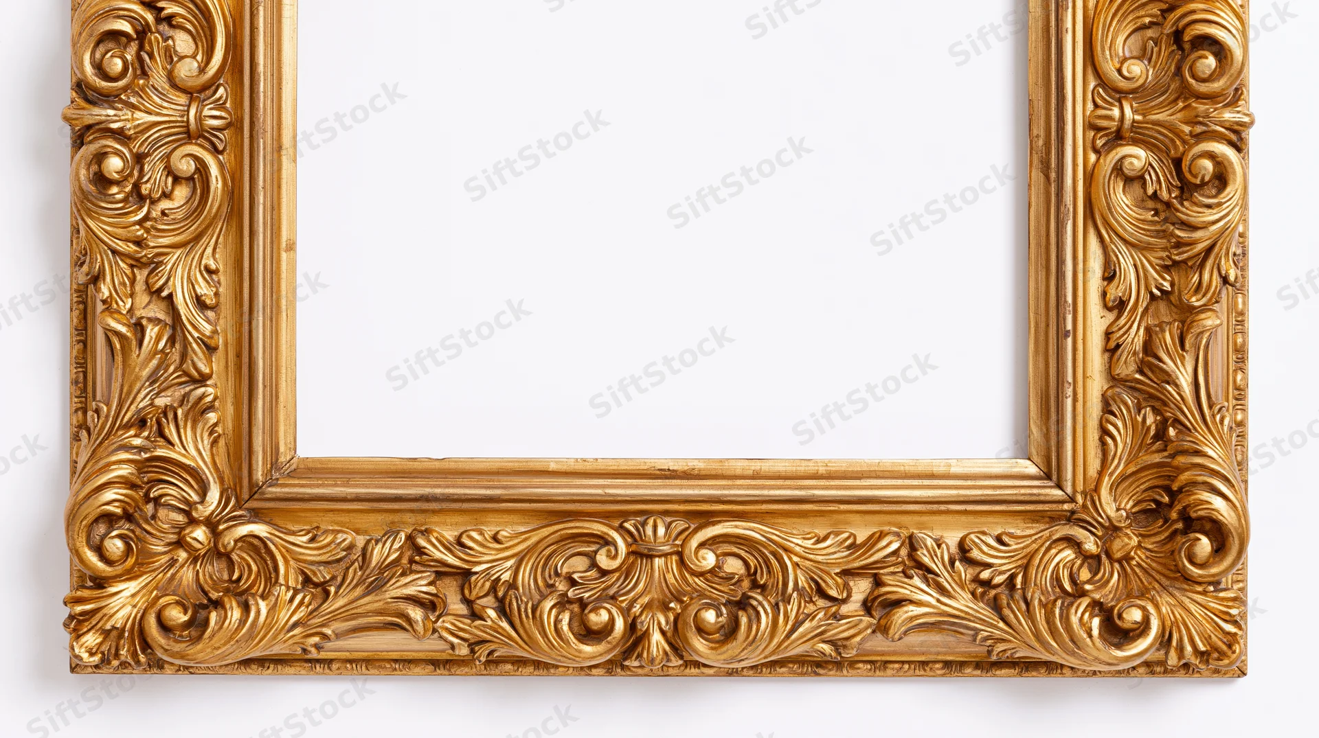 Ornate baroque gold picture frame with intricate scrollwork and acanthus leaf carvings, isolated on white background