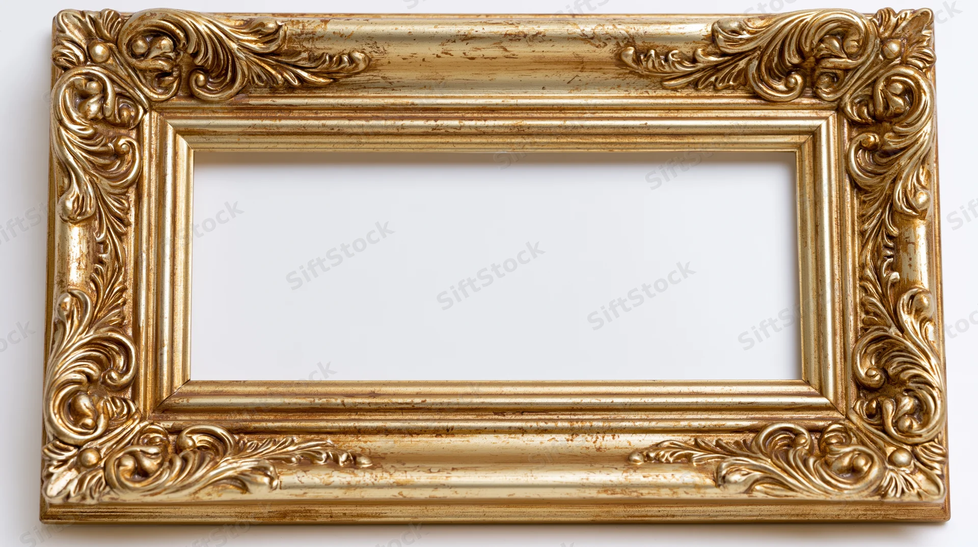 Ornate gold baroque picture frame with intricate scrollwork on white background