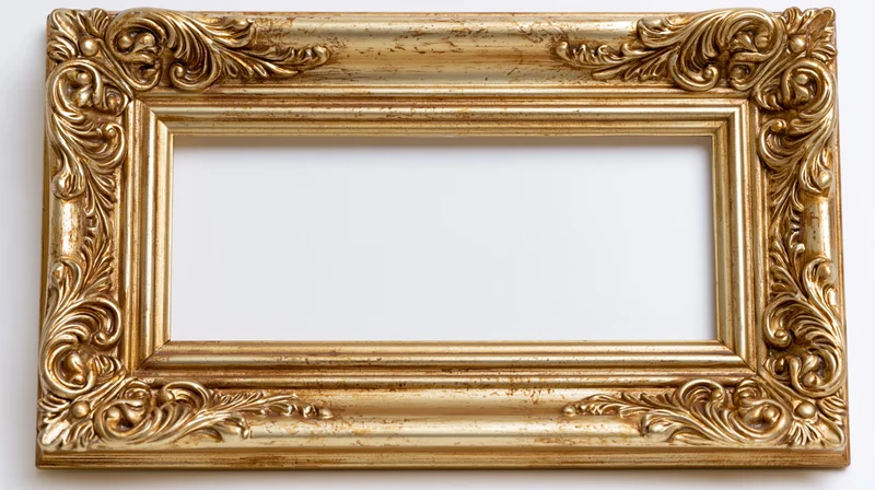 Ornate gold baroque picture frame with intricate scrollwork on white background