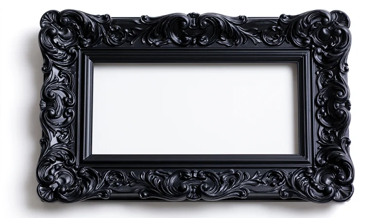 Ornate black baroque picture frame with elaborate carved scrollwork isolated on white background