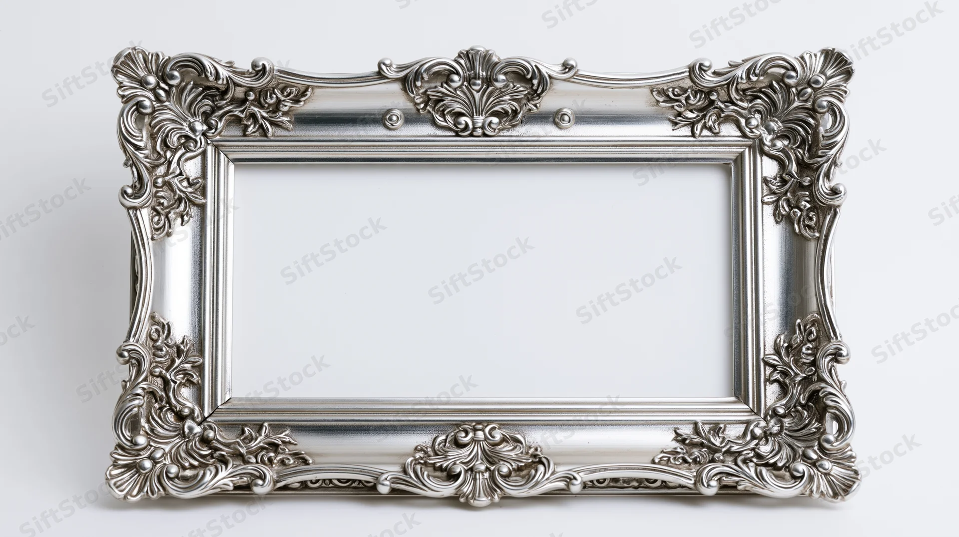 Ornate silver baroque frame with intricate scrollwork on white background