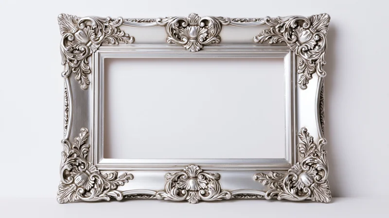 Ornate silver baroque picture frame with intricate scrollwork standing against white background