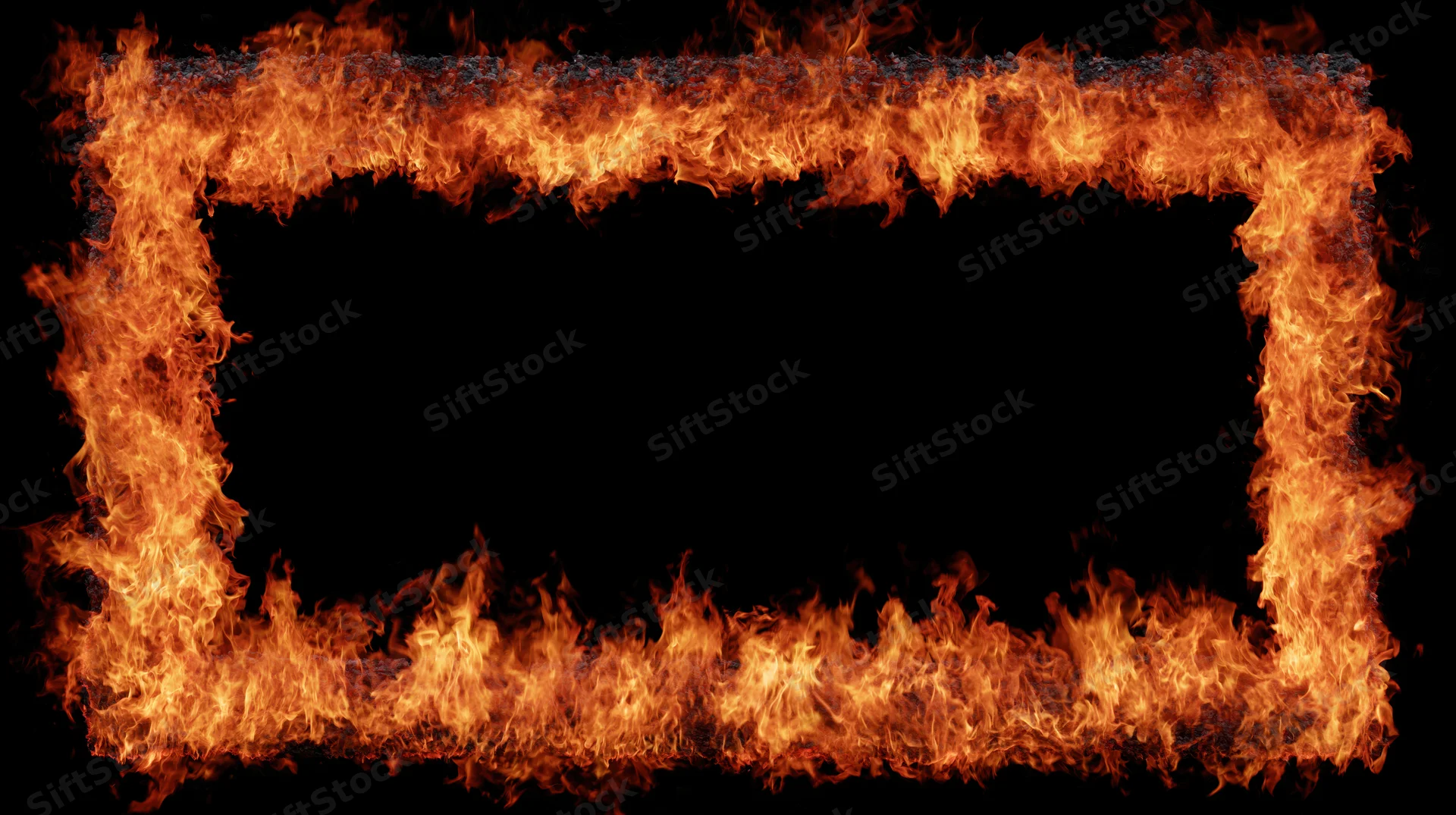 Rectangular frame of intense fire flames forming a border around a black center with copyspace